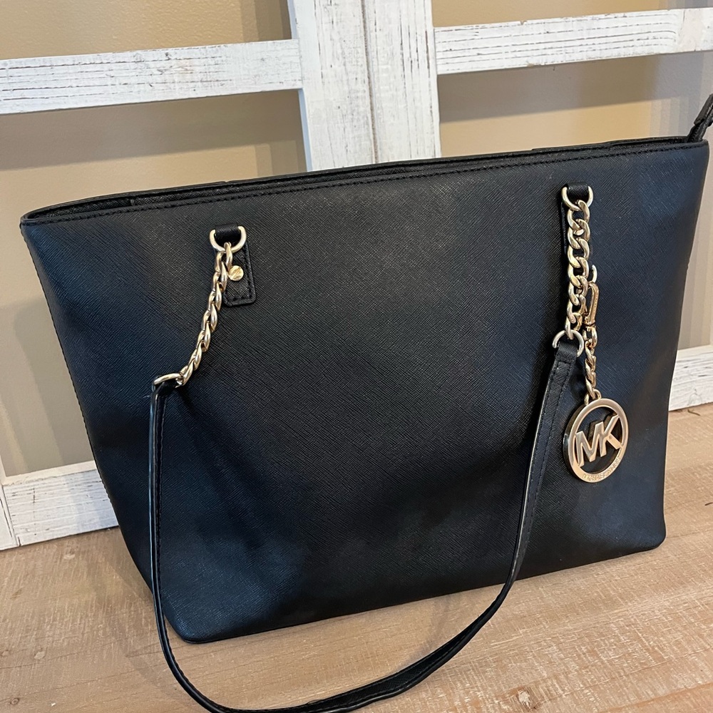 Michael Kors solid black purse with gold accents